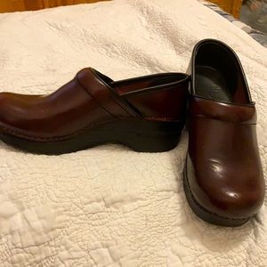 Never worn Dansko clogs